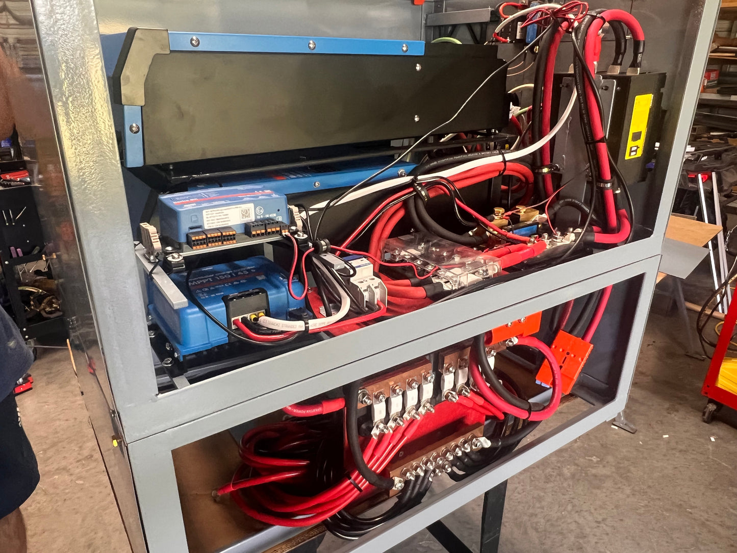 Electrical panel with wires and components in a workshop setting