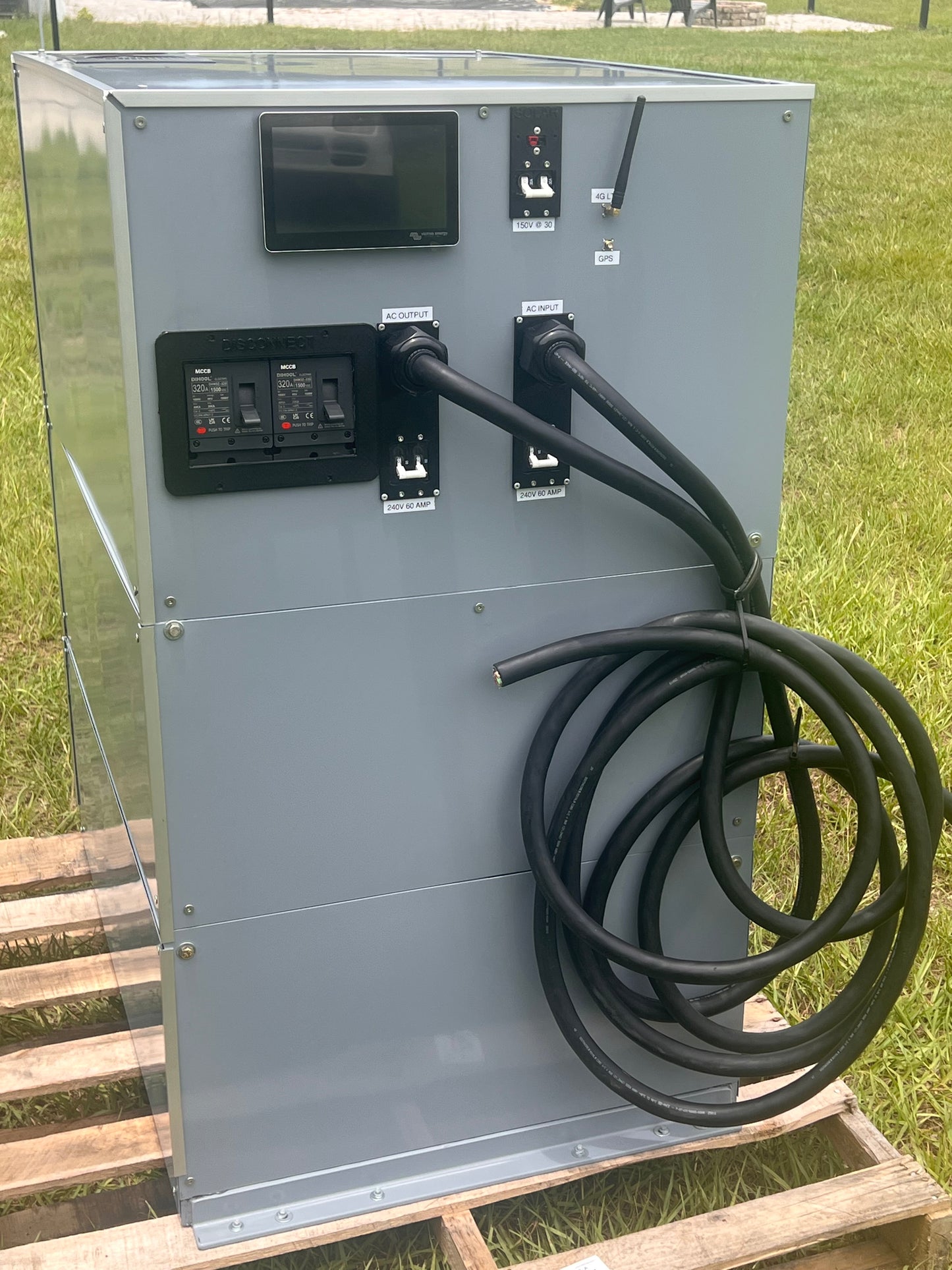 Electrical panel with cables and switches on a wooden platform